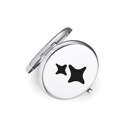 Compact mirror with star designs on a white background